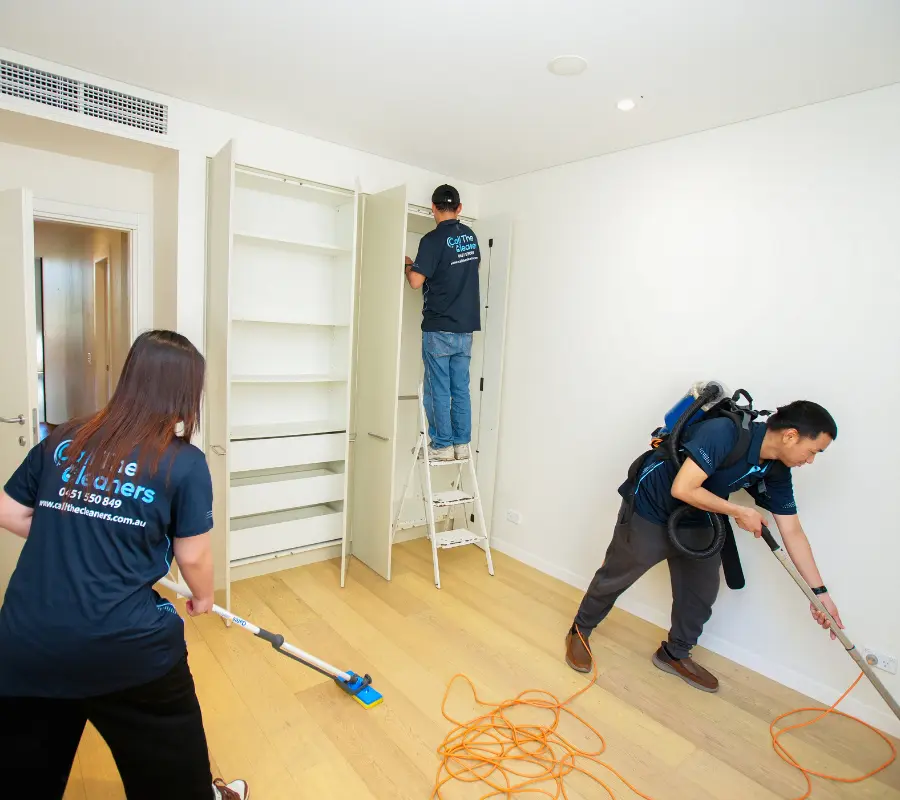 Professional cleaners performing end of lease cleaning in a Canberra rental home before inspection